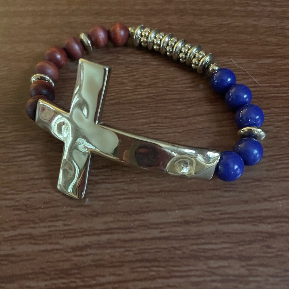 Blue and brown stretch bracelet with gold cross